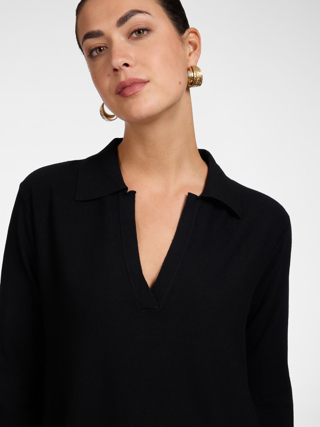 Black polo knit neckline with V-placket and collar, long sleeves