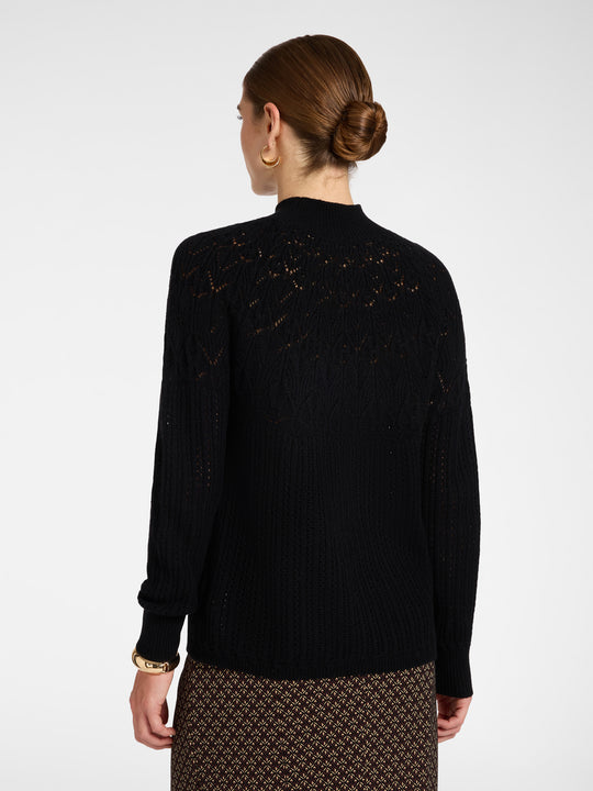 Black wool rib knit pullover with perforated back detail, mock neck, long sleeves