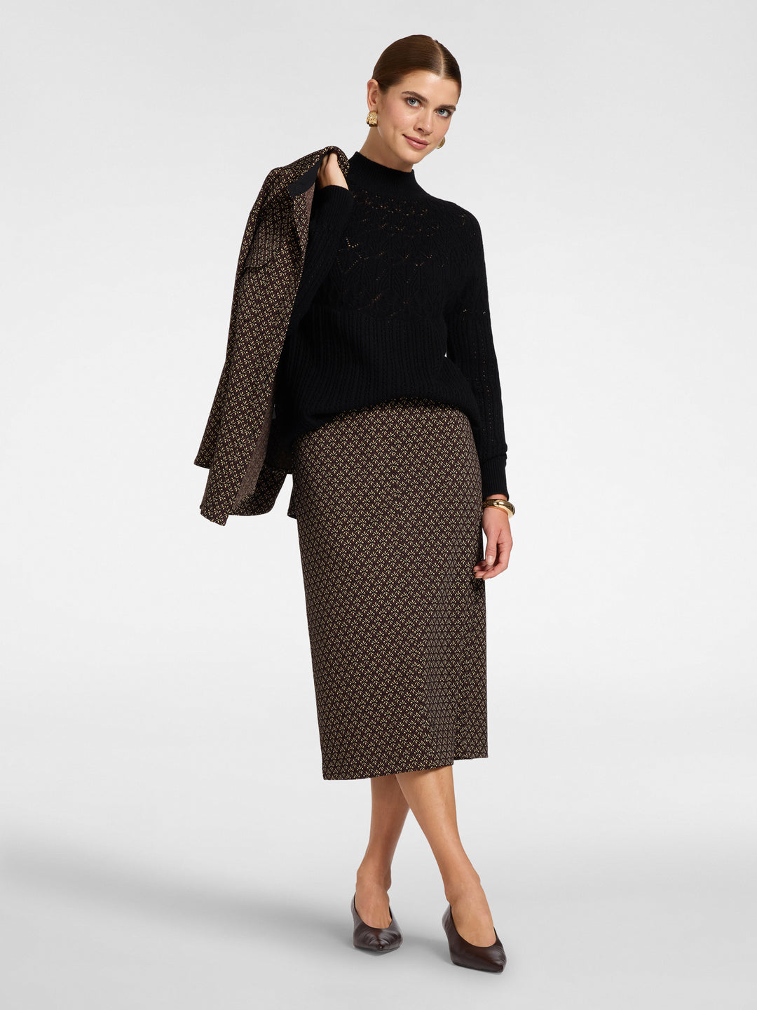 Black wool pullover with mock neck and perforated knit, rib cuffs, long sleeves