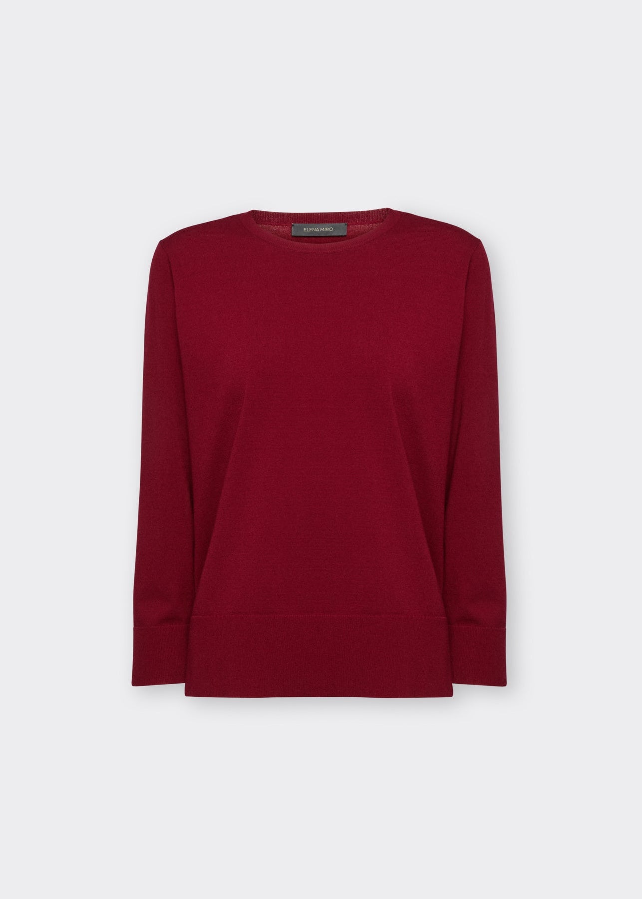 Red long-sleeve jersey pullover with crew neckline and straight hem