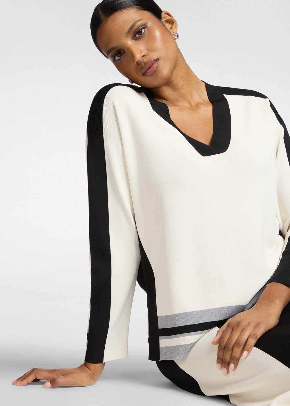 Front view of plus size Elena Miro Bi Color Compact Viscose V-Neck Sweater in Juta Black