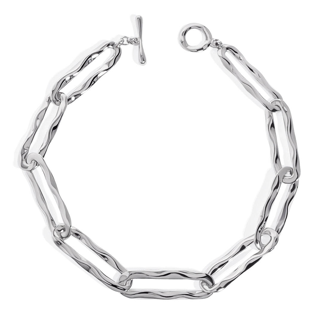 Silver chainlink collar necklace with toggle clasp on white background