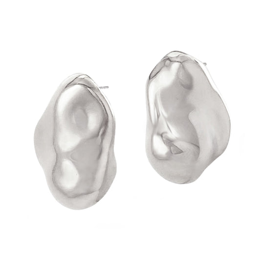 Two organic shaped molten-style stud earrings with hammered metallic finish on white background