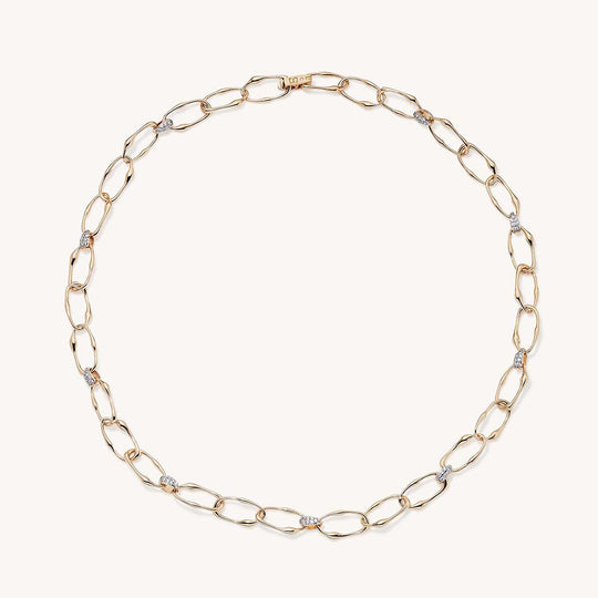 Gold oval link chain necklace with diamond pavé connectors, displayed in circular shape