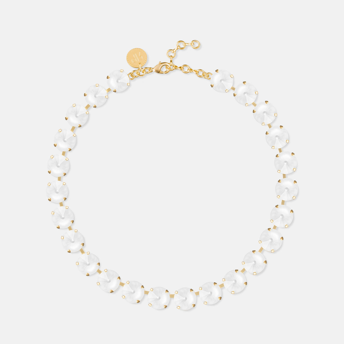 Gold necklace with repeating clear oval stones and white beaded accents, clasp closure