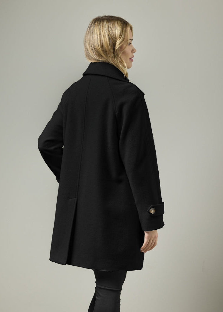 Black wool blend A-line coat with raglan shoulders, rear three-quarter view on model