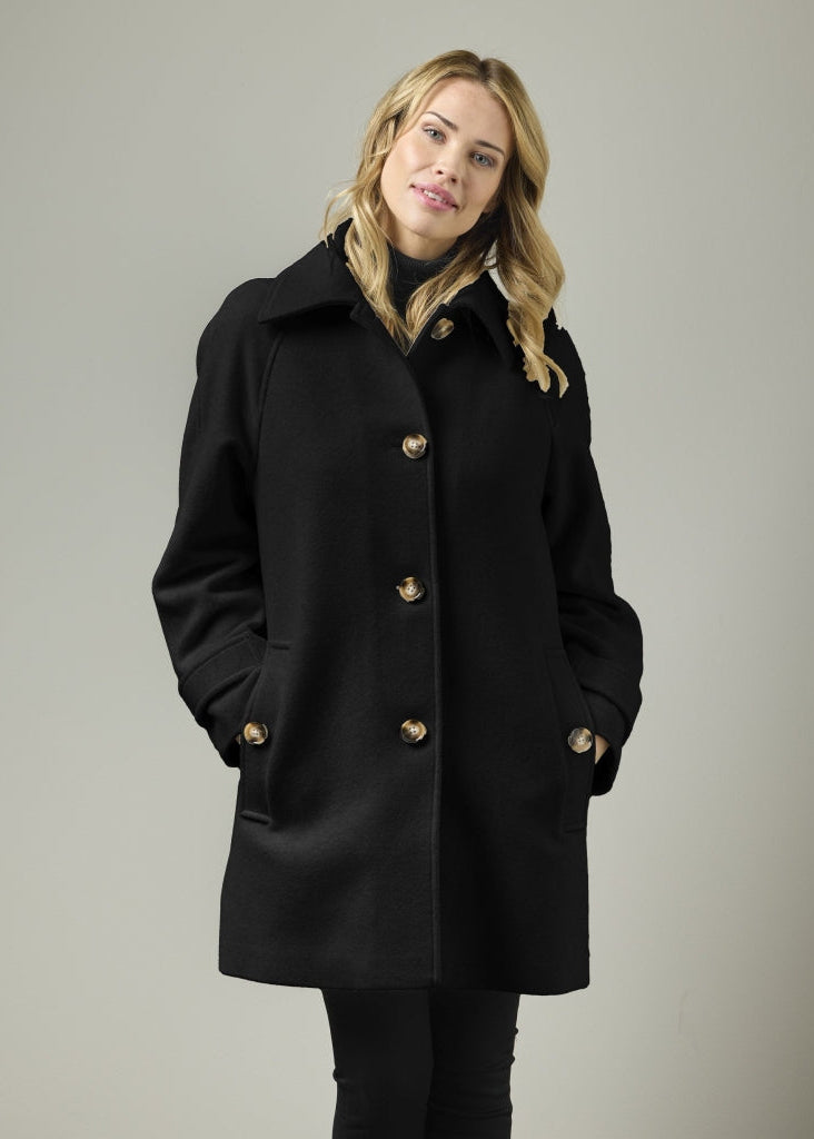 Black wool blend A-line coat with gold buttons and raglan sleeves, front three-quarter view on model