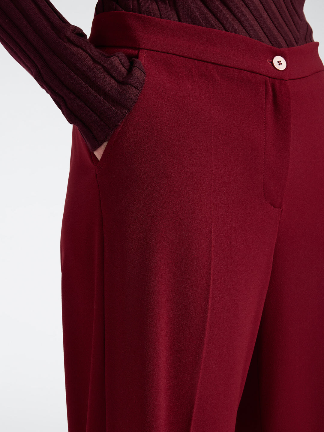 Men's deep red stretch crepe trousers detail with button closure and pocket seams