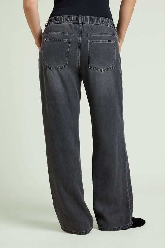 Black wash wide-leg jeans back view with two rear pockets and belt loops