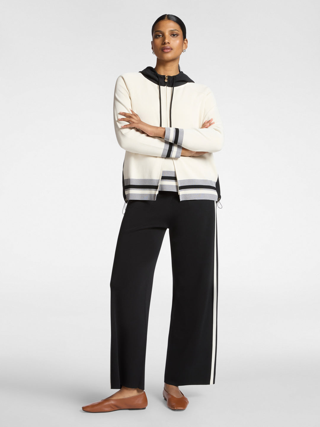 Black wide-leg compact knit pants with vertical side stripe and drawstring waist