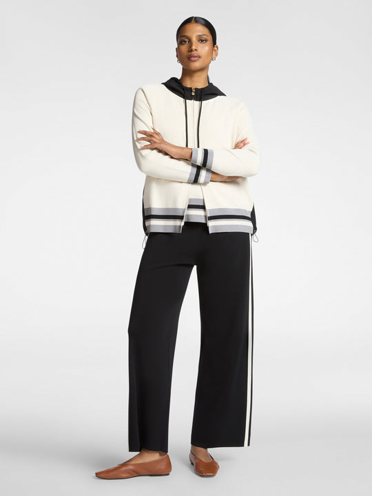 Black wide-leg compact knit pants with vertical side stripe and drawstring waist