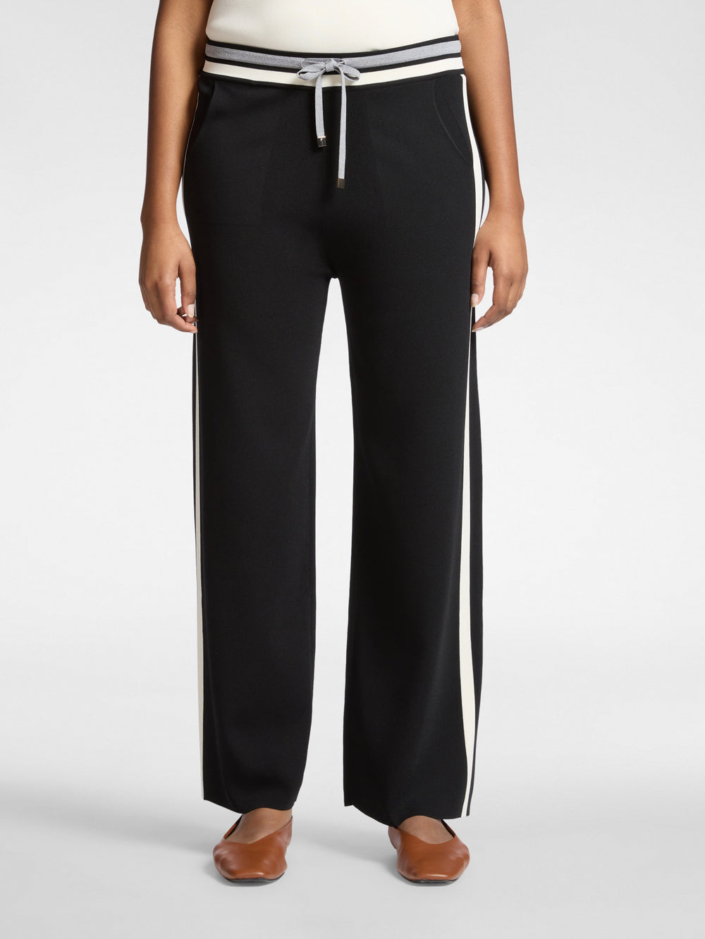 Black wide-leg drawstring pants with white side stripes and ribbed banded waist