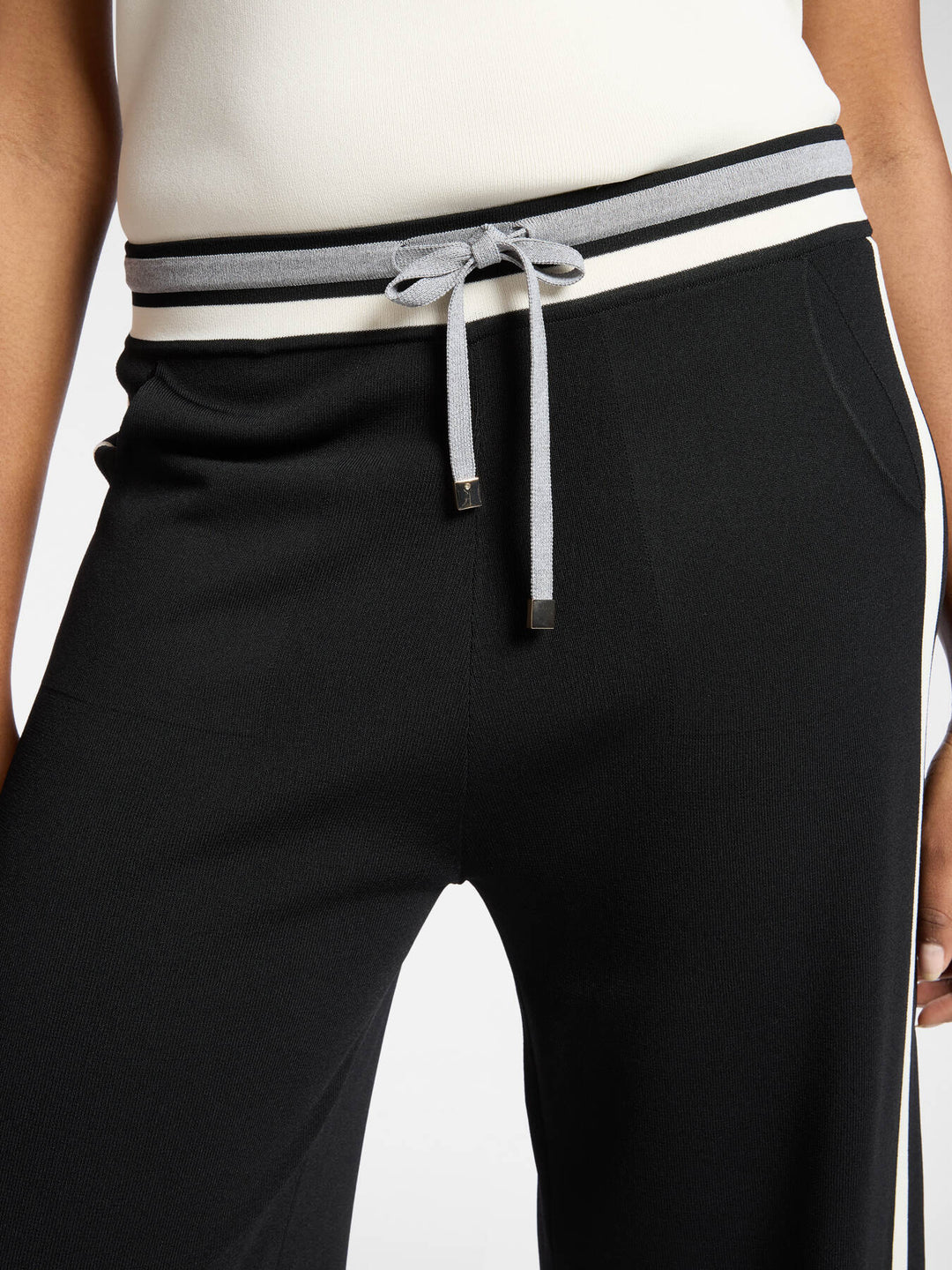 Black wide-leg pants with striped waistband band and drawstring ties