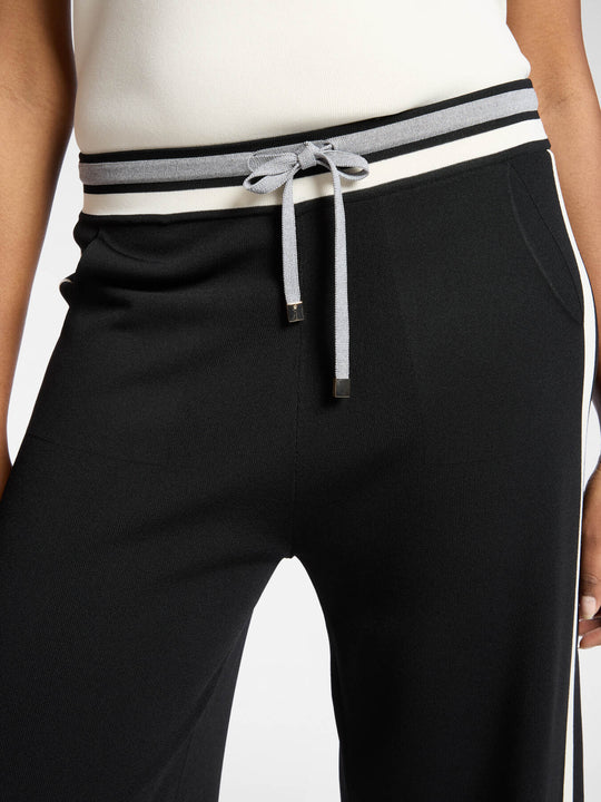 Black wide-leg pants with striped waistband band and drawstring ties