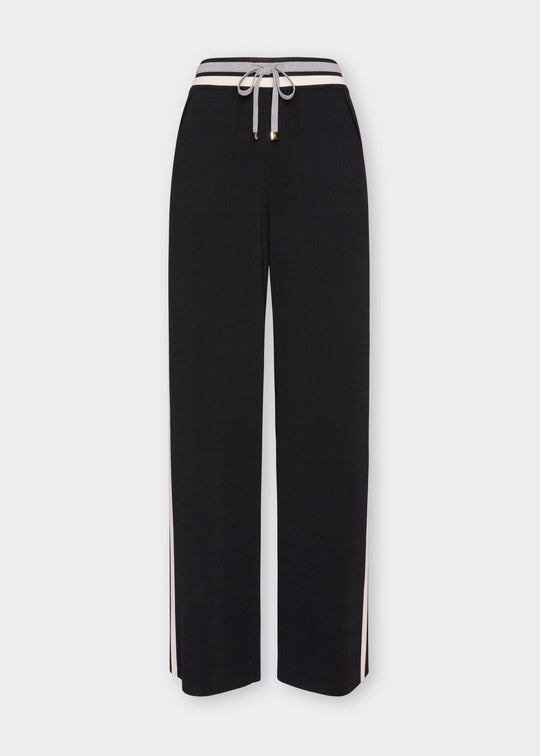 Black wide-leg knit drawstring pants with white side stripe detail and elastic waistband
