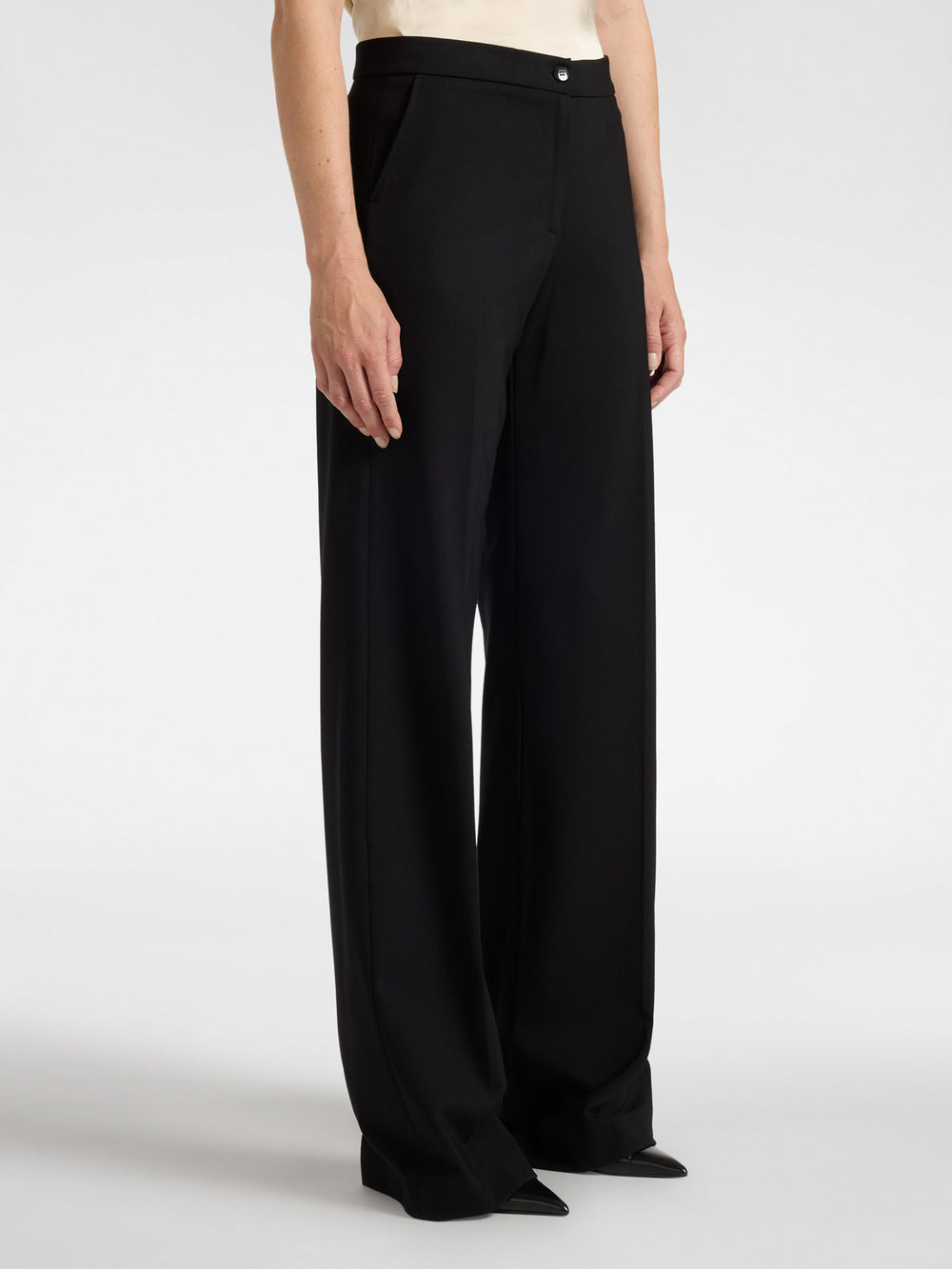 Men's black tailored trousers with belt loops and front button closure