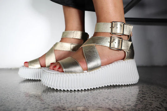 top view of Minx Plaza Platform with Ankle Strap in Soft Gold on model