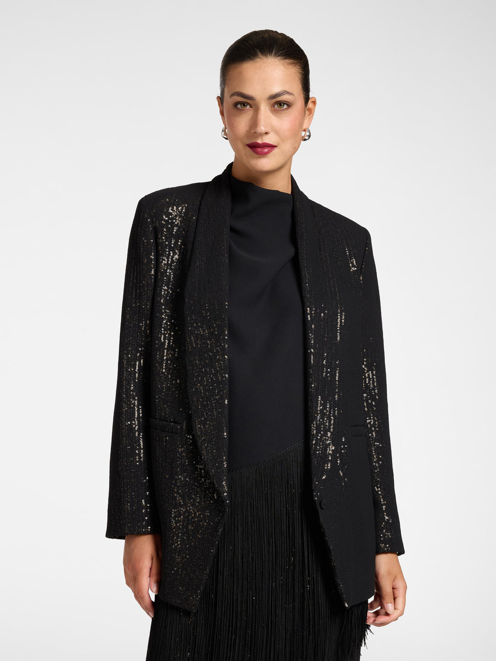 Black sequin blazer with shawl collar and open front, long sleeves, textured finish.