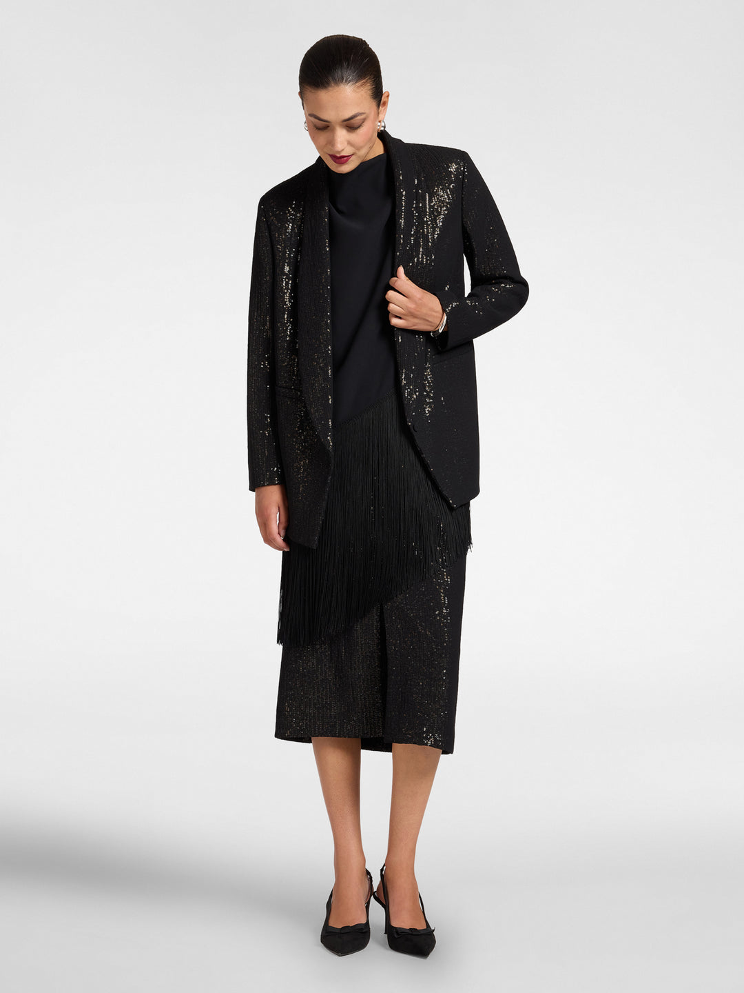 Black sequin blazer with shawl collar, open front, straight hem, long sleeves.