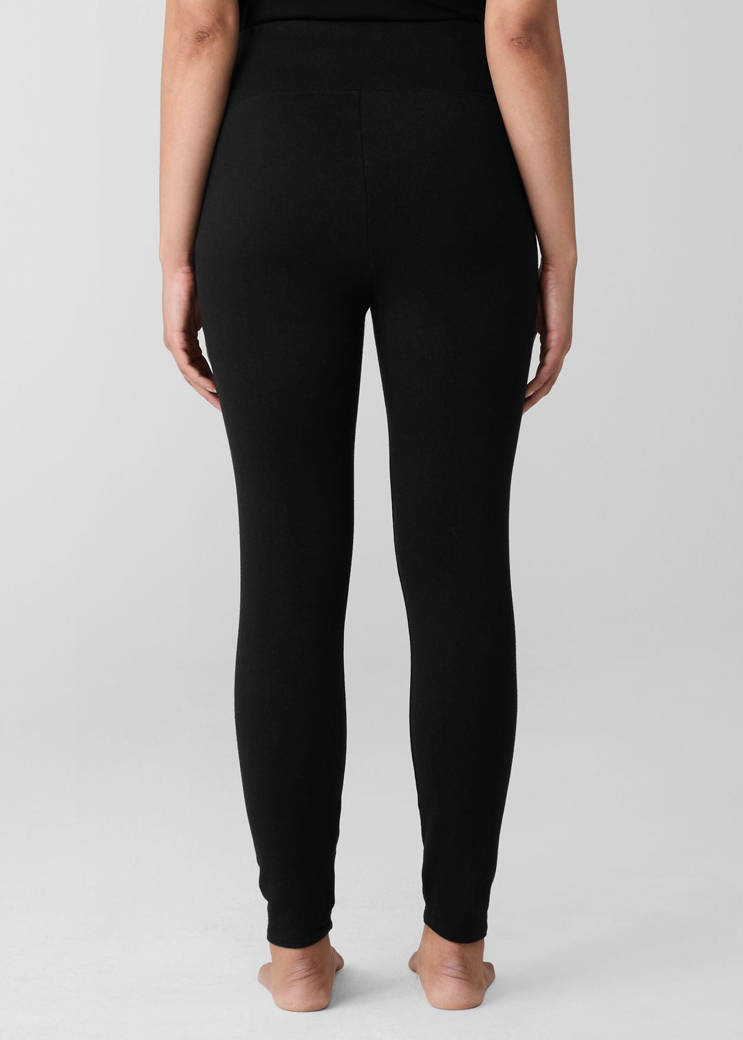back view of plus size Eileen Fisher Cozy Brushed Terry Hug High Waited Ankle Legging in Black