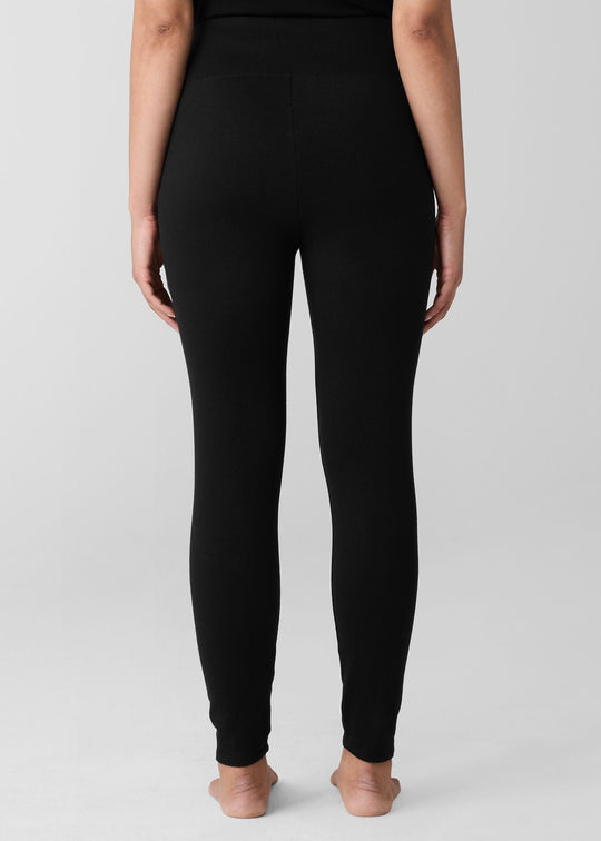 back view of plus size Eileen Fisher Cozy Brushed Terry Hug High Waited Ankle Legging in Black