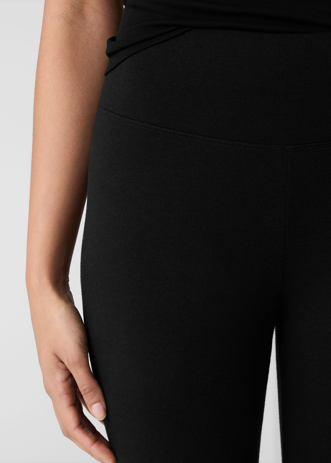 close up front view of plus size Eileen Fisher Cozy Brushed Terry Hug High Waisted Ankle Legging in Black