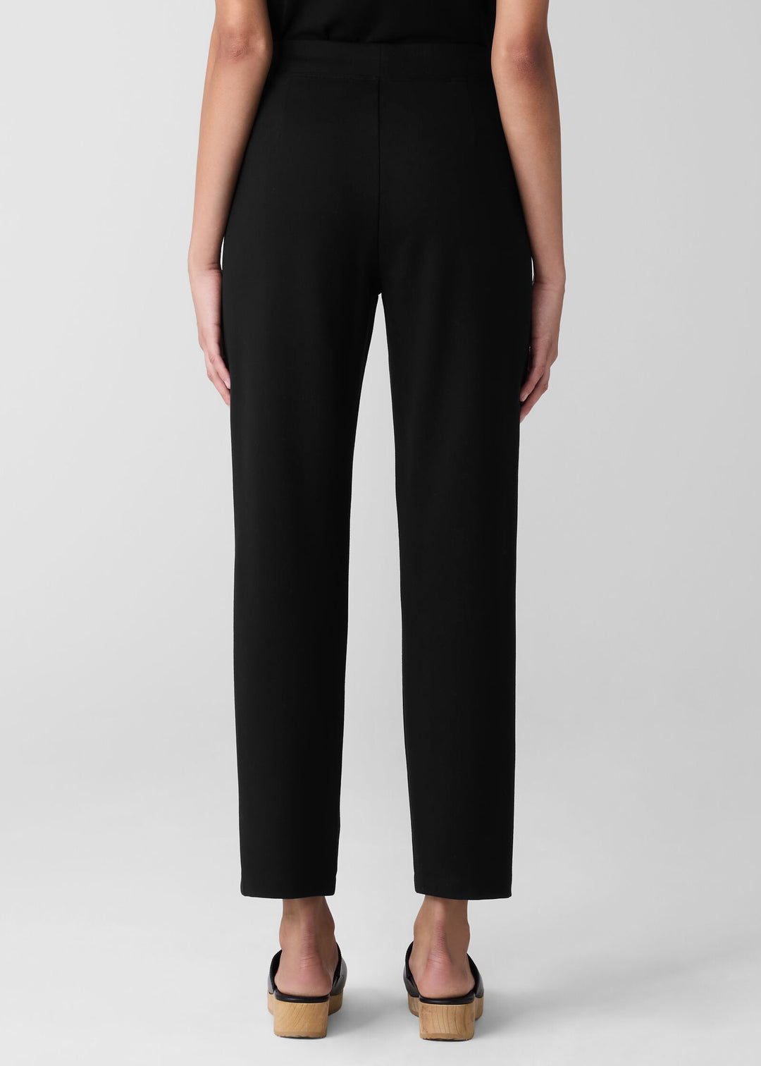 back view of plus size Eileen Fisher Slim Ankle Ponte Pant in Black