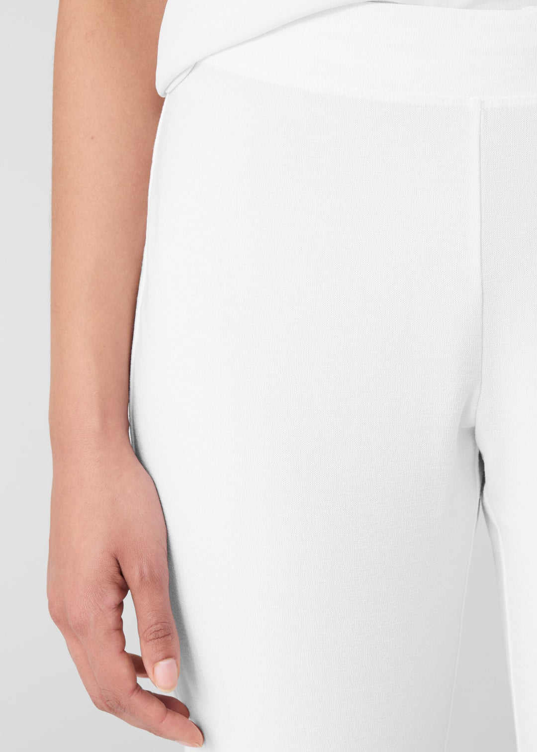 close up front view of Eileen Fisher stretch crepe slim leg pull on plus size pant in white
