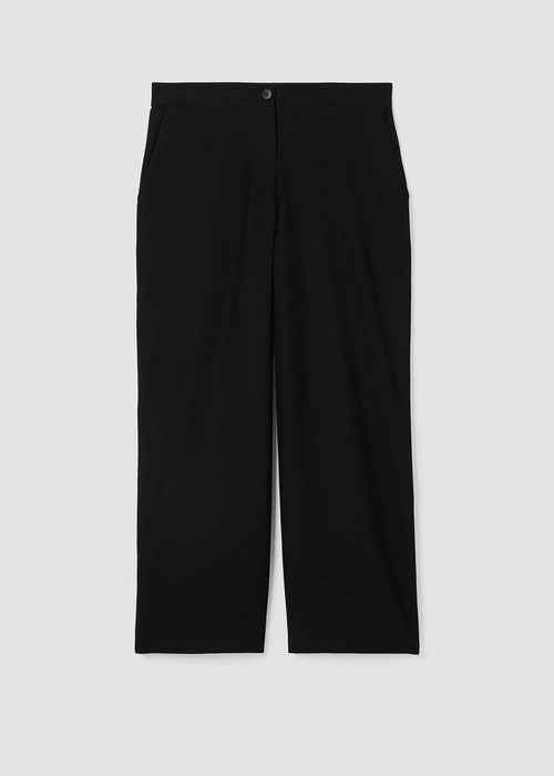 Black wide-leg ankle pants with single button closure, flat lay studio photograph