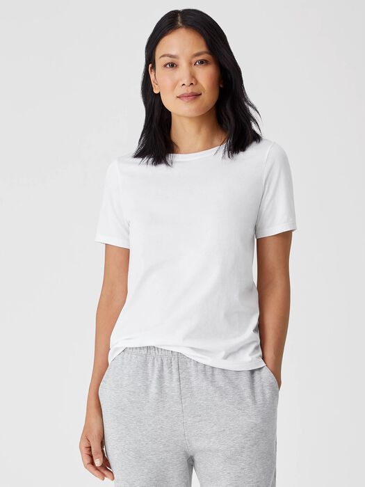 White short sleeve cotton jersey t-shirt on model, front view against light background