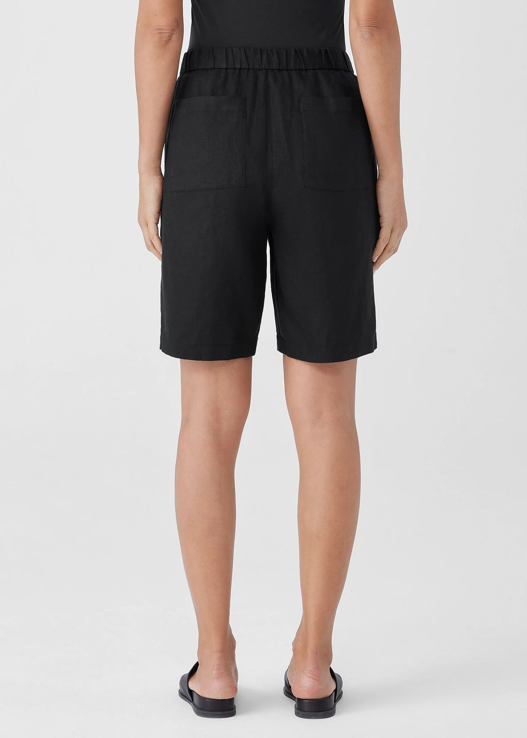 back view of Eileen Fisher Organic Linen zip front Elastic Waist plus size Shorts in Black