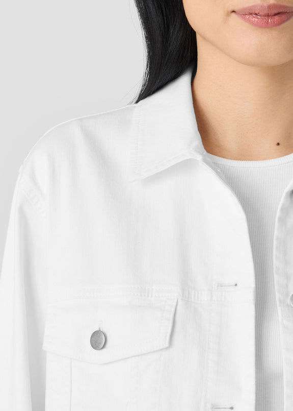 close up front view of Eileen Fisher plus size stretch white denim jean jacket