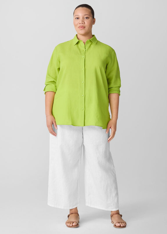 front view of Eileen fisher classic collar long sleeve button front organic linen shirt on plus size model in chartreuse 