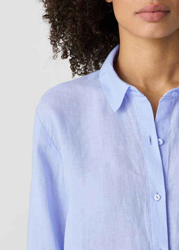 close up front view of Eileen fisher classic collar long sleeve button front organic linen pus size shirt in color bellflower