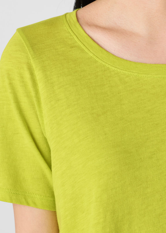 close up front view of Eileen Fisher plus size short sleeve jersey linen t-shirt in chartreuse