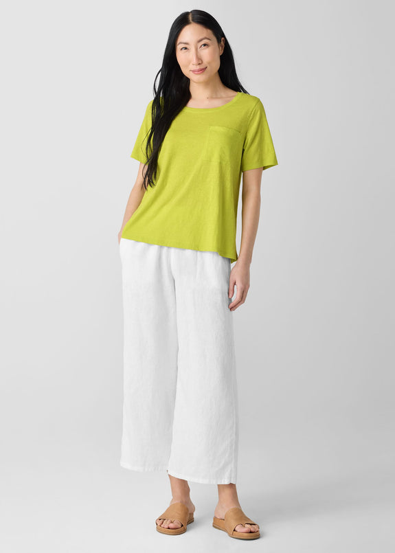 alt. front view of Eileen Fisher plus size short sleeve jersey linen t-shirt in chartreuse styled with white pant