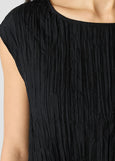 close up front view of plus size Eileen Fisher Crushed Silk Ballet Neck Pleated Top in Black