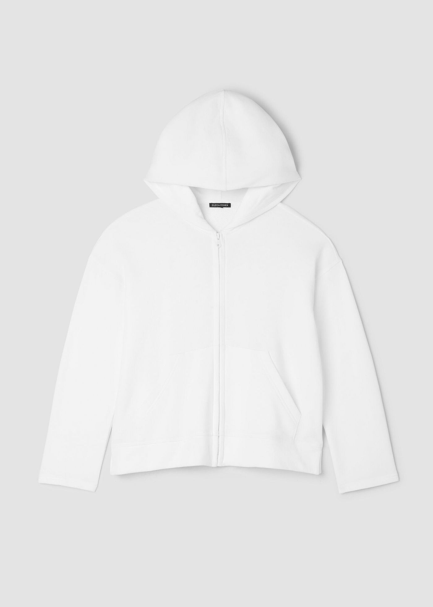 front view of plus size Eileen Fisher white hoodie on a light gray background
