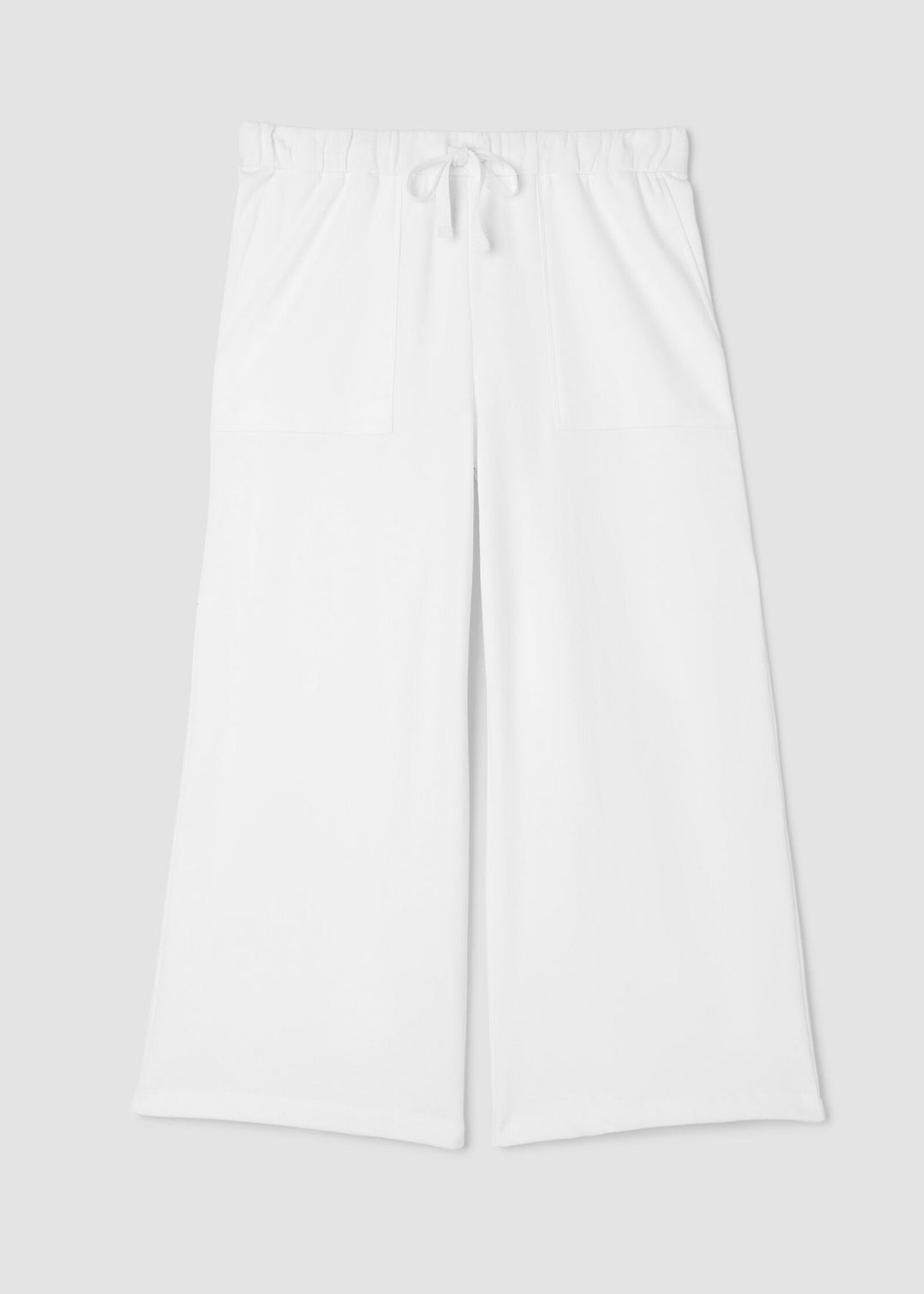 Eileen Fisher white pants on a light gray background