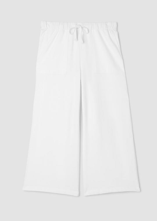 Eileen Fisher white pants on a light gray background