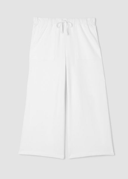 Eileen Fisher white pants on a light gray background