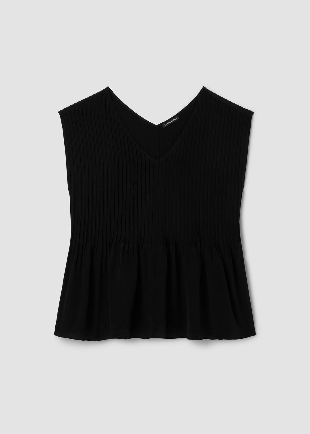Black sleeveless top on a light gray background