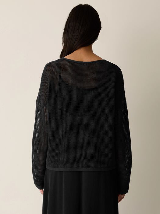 Black open-knit sweater back view, V-neckline and loose long sleeves.