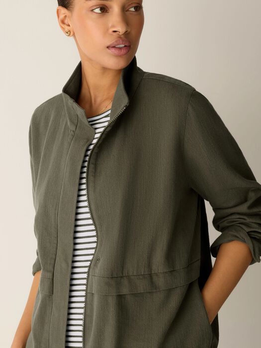 Olive zip-up jacket close-up with stand collar and front flap chest pocket