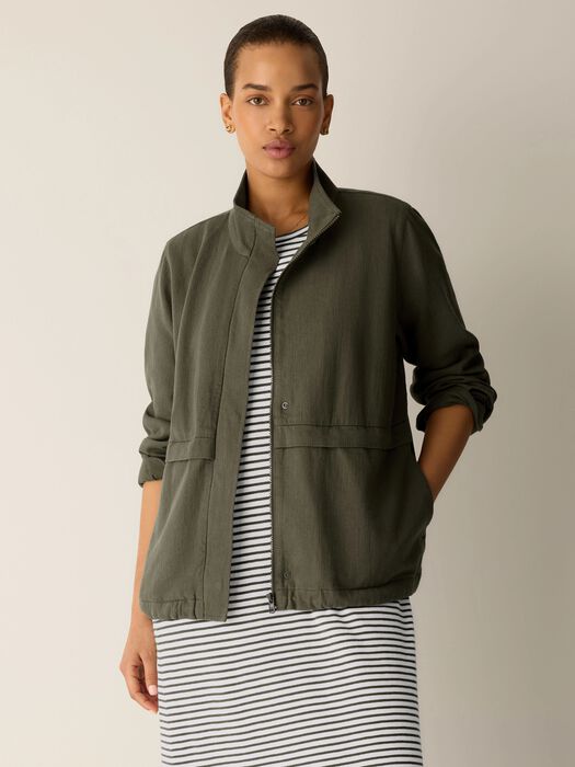 Olive zip-up jacket with stand collar, flap chest pockets, and long sleeves