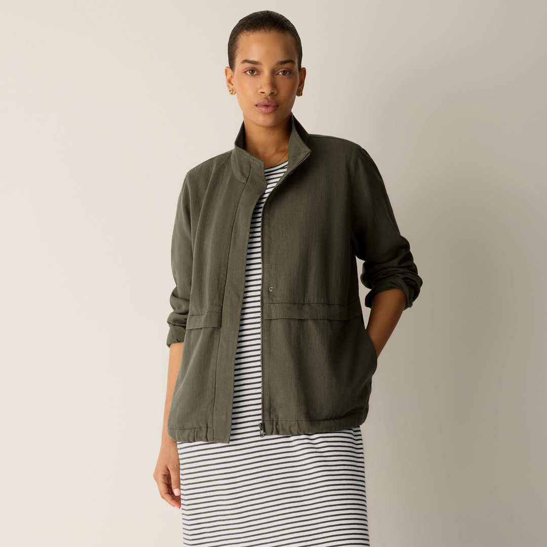 Olive zip-up jacket front view with stand collar and drawstring hem details