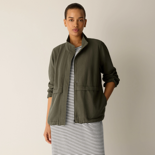 Olive zip-up jacket front view with stand collar and drawstring hem details