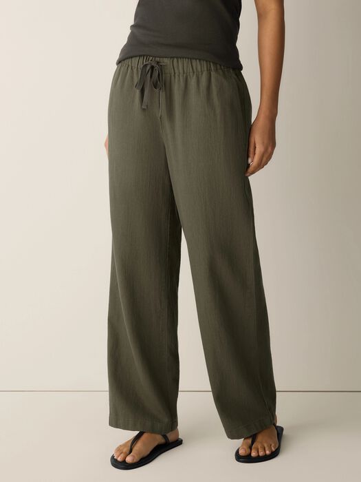 Olive straight-leg pants with elastic drawstring waist; relaxed fit, ankle-length