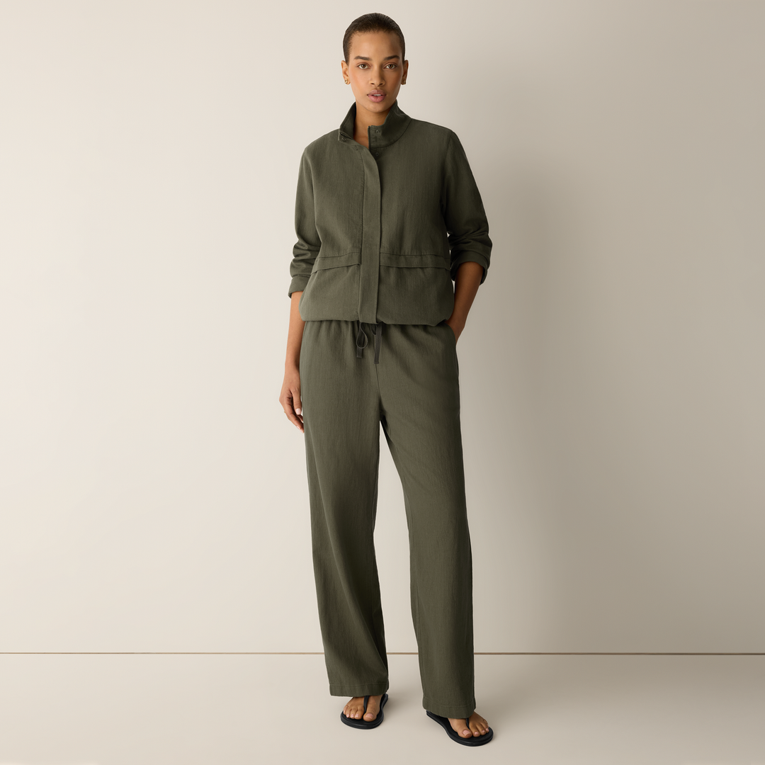 Olive straight-leg pants with elastic waistband and drawstring; relaxed straight fit