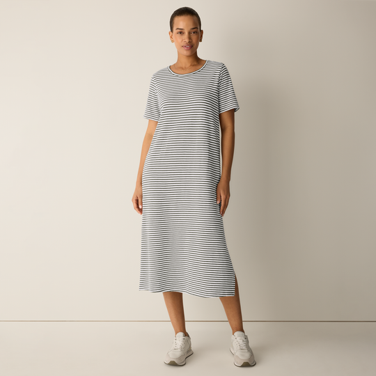 Green-and-white striped midi dress, round neck and short sleeves, model wearing front